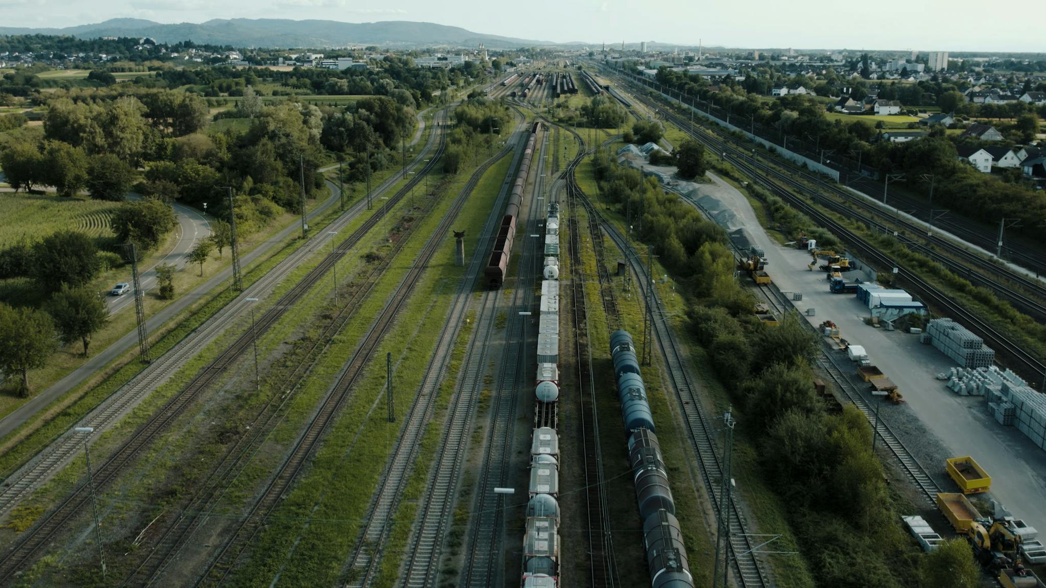 Drone shot of freight train yard in Offenburg, Germany, showing extensive railway infrastructure.